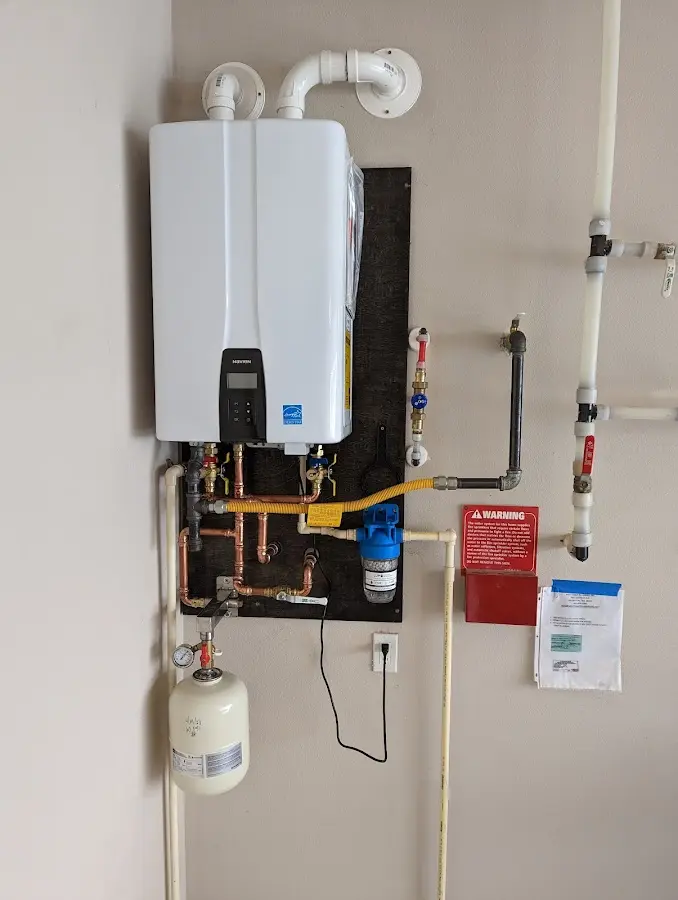 Professional plumber installing copper piping in a Anthony home